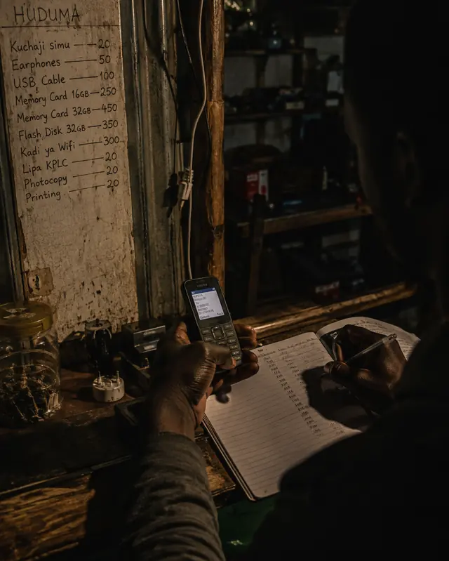 A price board, a phone and a ledger