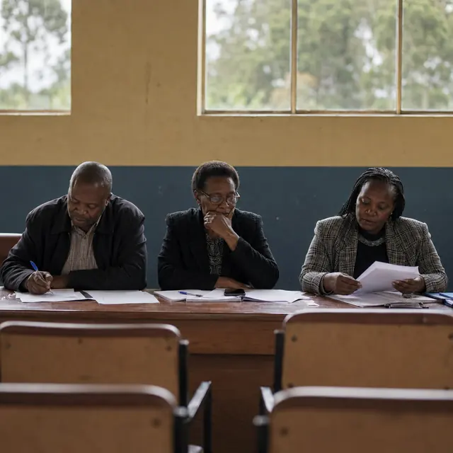 A panel reviewing papers